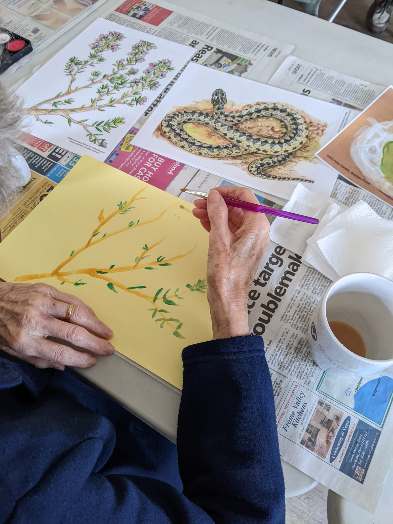 Image of woman drawing tree branch